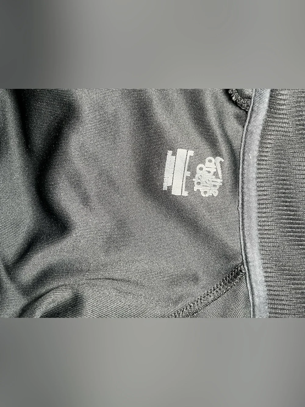 Vintage Nike Black Track Jacket with White Chevron Accents